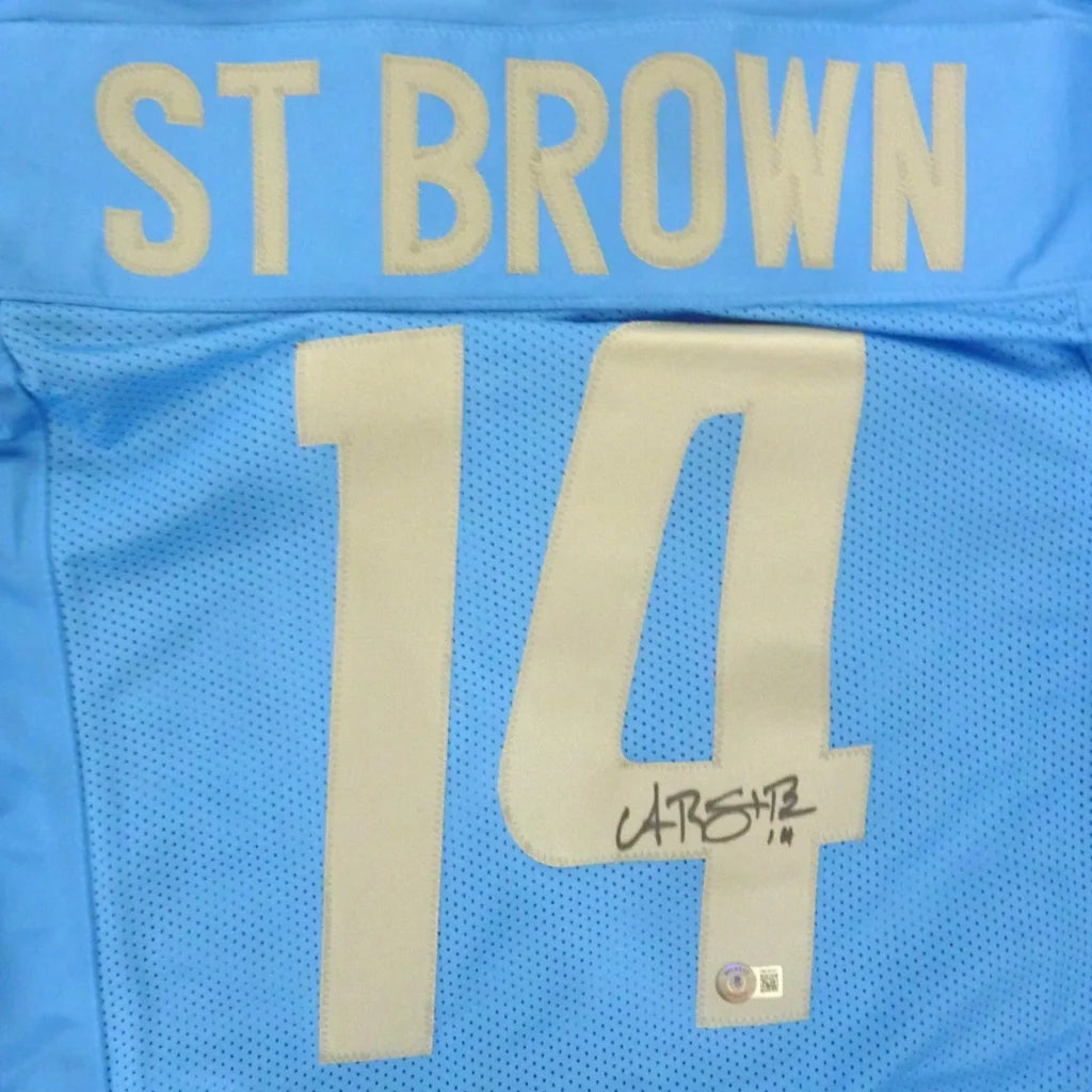 Amon-Ra St. Brown autographed custom jersey in bold blue with Carolina Panthers #14