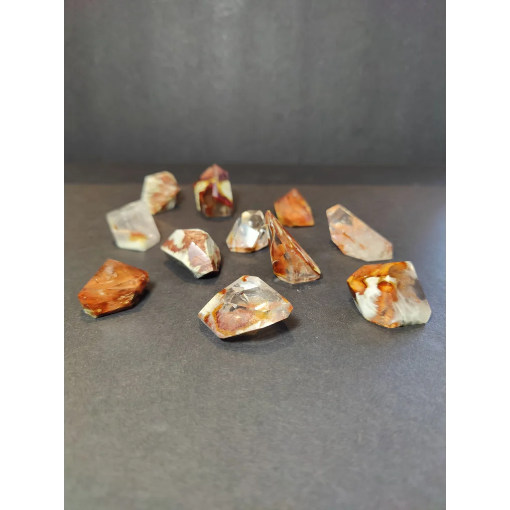 Amphibole angel phantom quartz polished freeform with clear quartz crystals and amber white inclusions revealing facets