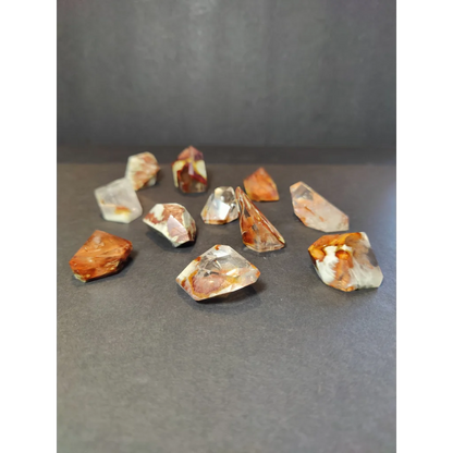 Amphibole angel phantom quartz polished freeform with clear quartz crystals and amber white inclusions revealing facets