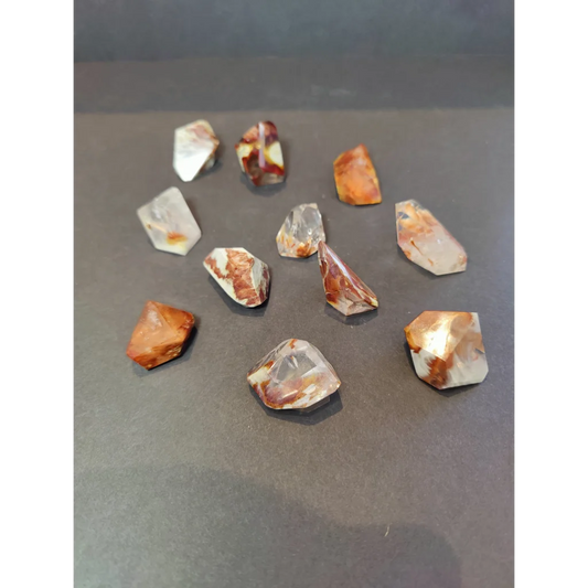 Amphibole angel phantom quartz polished freeform with clear quartz and reddish-brown veining polished freeform