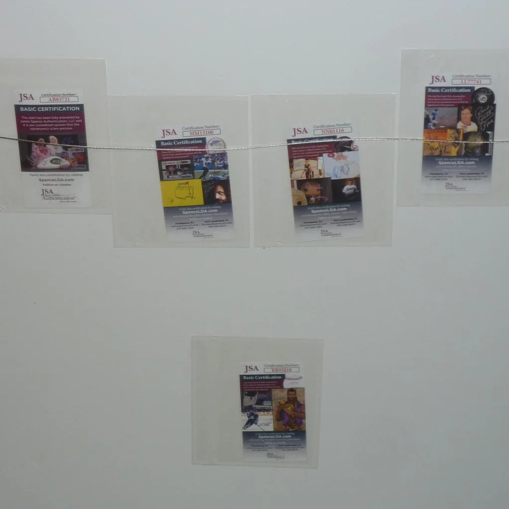 Four JSA certified cards in sleeves on deluxe framed Anchorman movie poster