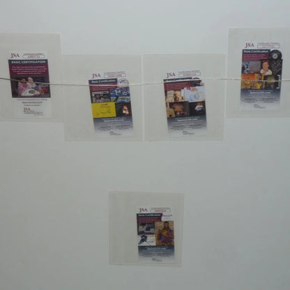 Four JSA certified cards in sleeves on deluxe framed Anchorman movie poster