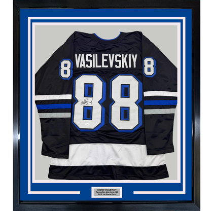 Black Tampa Bay Lightning #88 jersey with "VASILEVSKIY" nameplate and autographed number, framed with blue matting and authentication plaque.