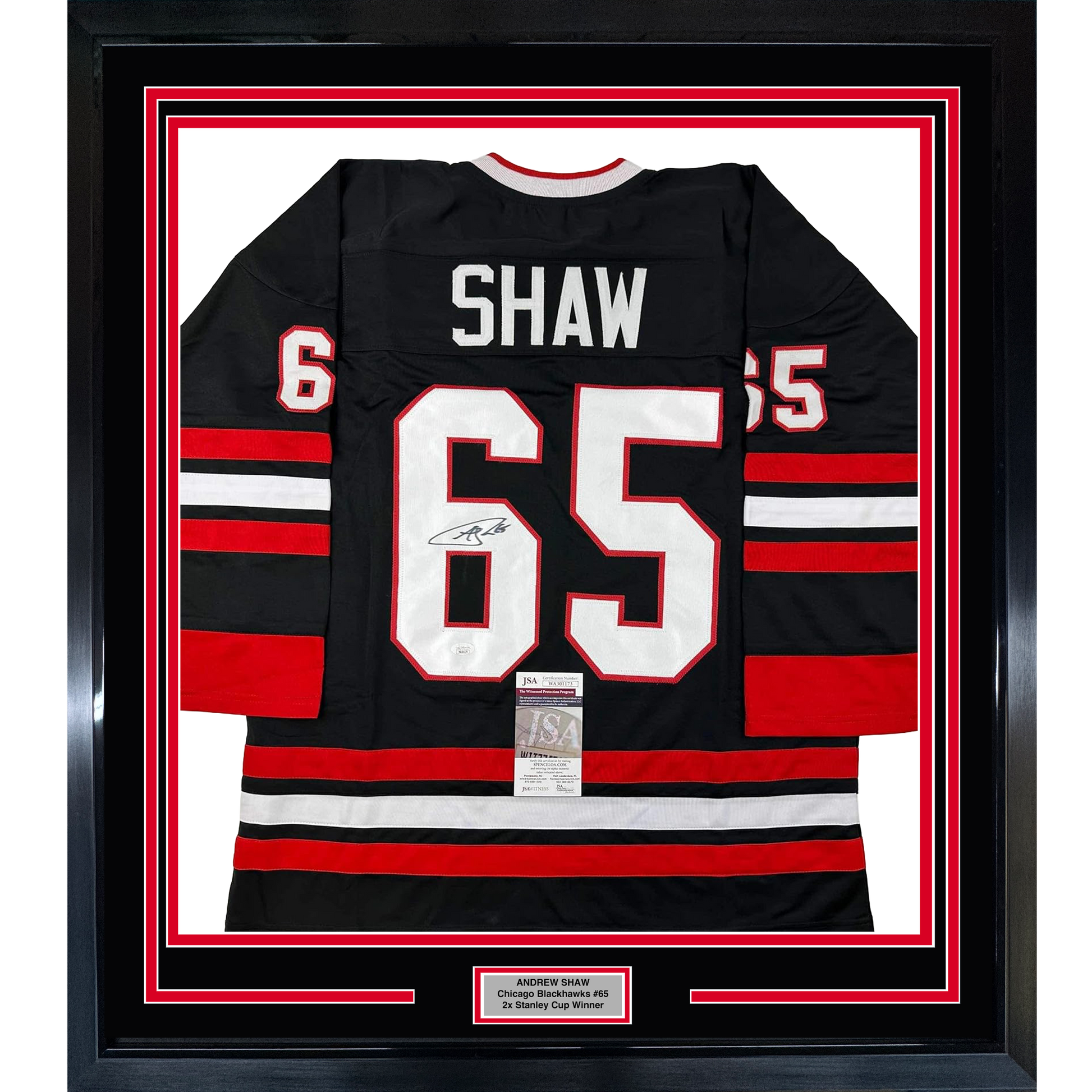 Framed black Chicago Blackhawks jersey number 65 with "SHAW" nameplate, red and white horizontal stripes, signed and authenticated with JSA certificate.