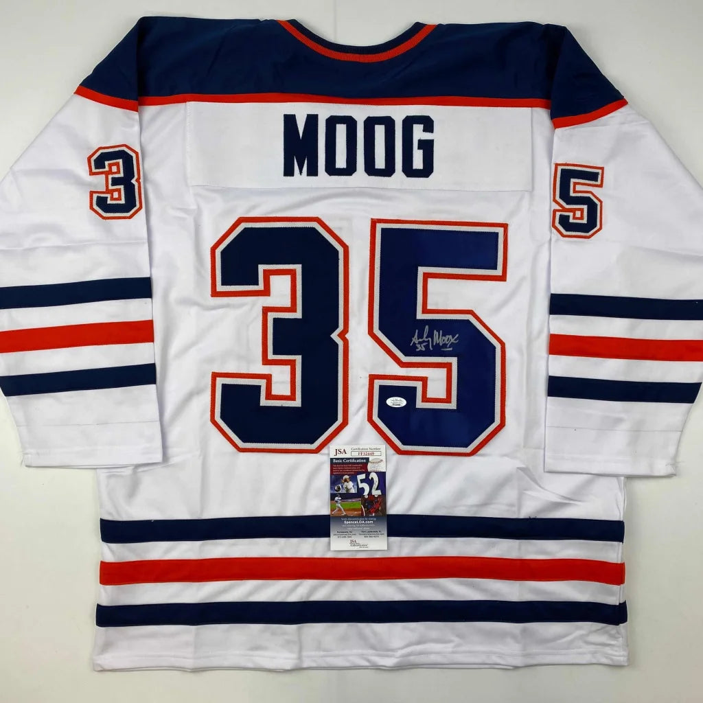 White Andy Moog signed custom jersey with navy blue and red accents, pro sports league gear