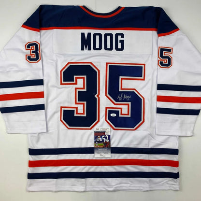 White Andy Moog signed custom jersey with navy blue and red accents, pro sports league gear