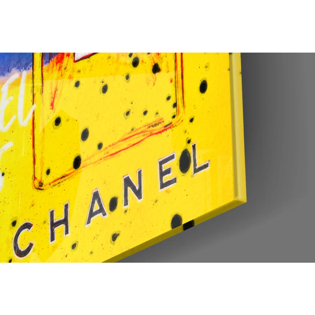 Vibrant yellow Chanel pop art wall art canvas with bold black lettering