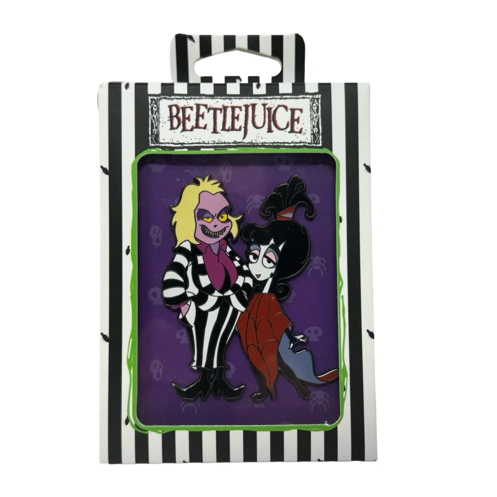 Beetlejuice and Lydia Deetz enamel pin set in striped collector box pin packaging