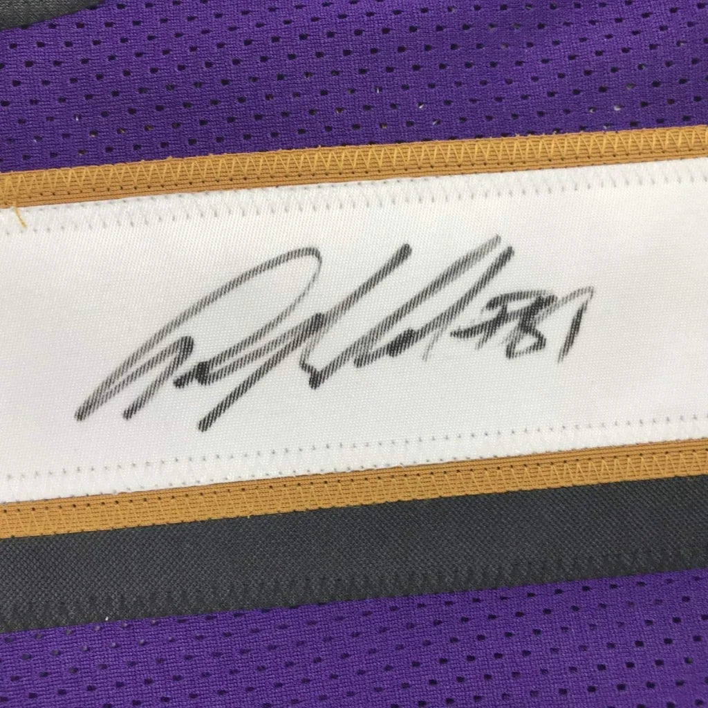 Purple and gold signed custom jersey from a professional sports league featuring Anquan Boldin