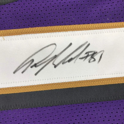Purple and gold signed custom jersey from a professional sports league featuring Anquan Boldin