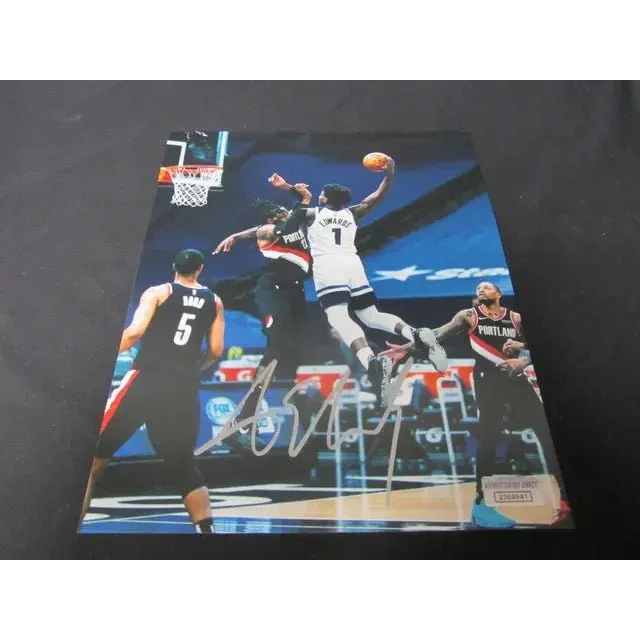 Autographed 8x10 photo of Anthony Edwards dunking over Trail Blazers player