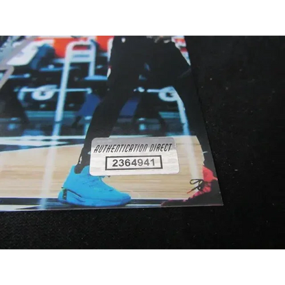 Anthony Edwards autographed 8x10 photo of him dunking, with Authentication Direct sticker