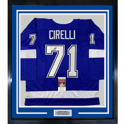 Blue Tampa Bay Lightning hockey jersey #71 signed by Anthony Cirelli, displayed flat in black frame with white matting and JSA authentication certificate.