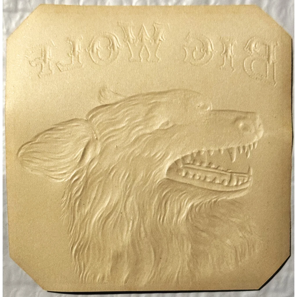 Embossed relief of a wolf’s head on antique 1900s Big Wolf Cigar Label