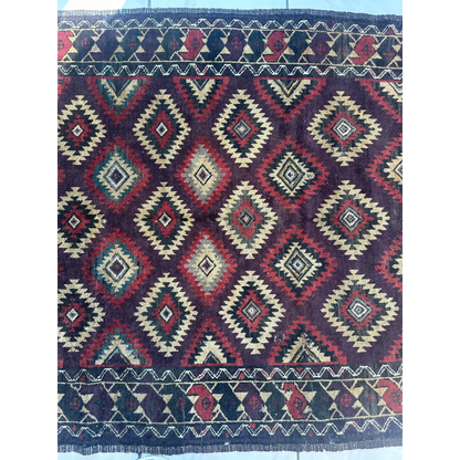 Antique 1900s tribal Baluch wool rug with dark purple geometric patterns
