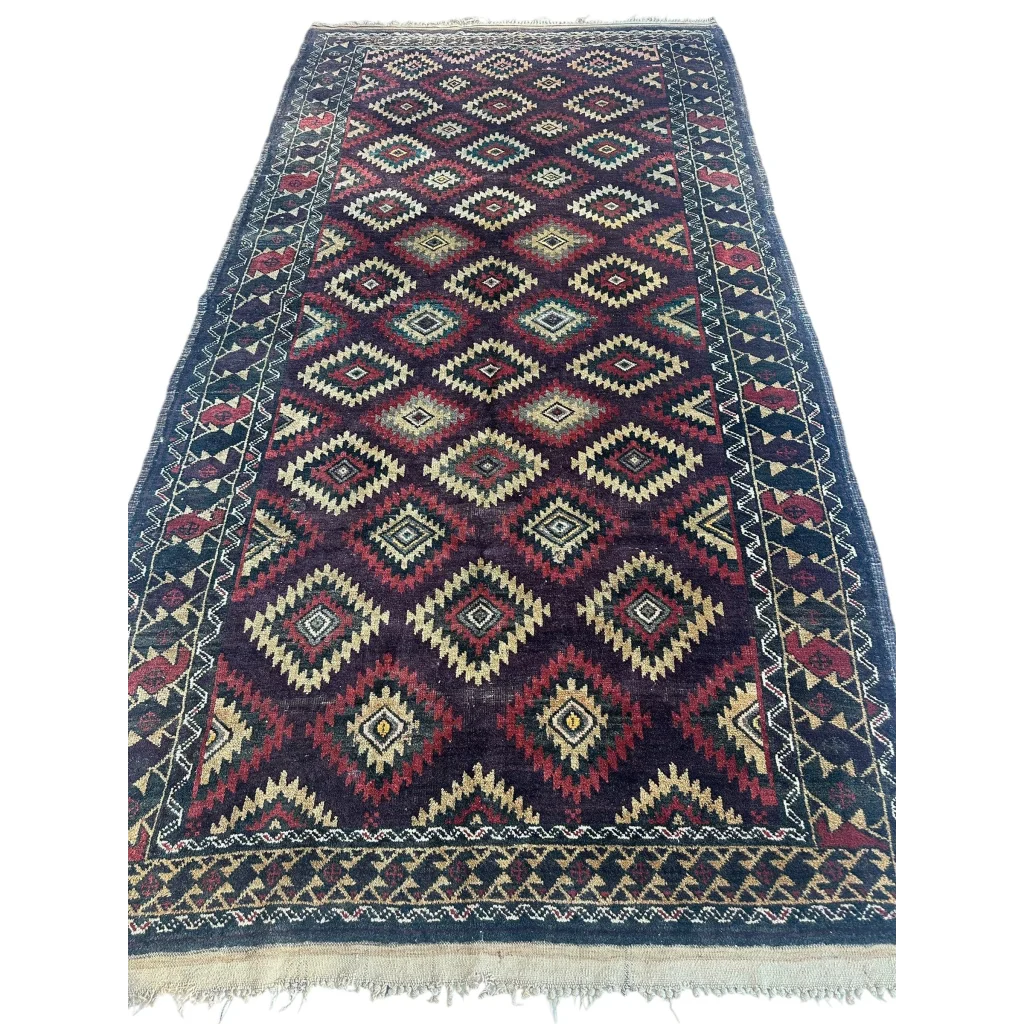 Antique 1900s tribal Baluch wool rug with geometric diamond pattern