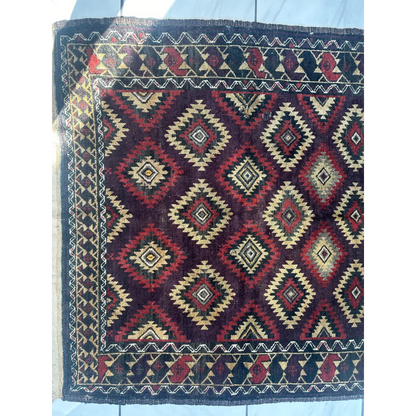 Antique 1900s tribal Baluch wool rug with bold geometric diamonds
