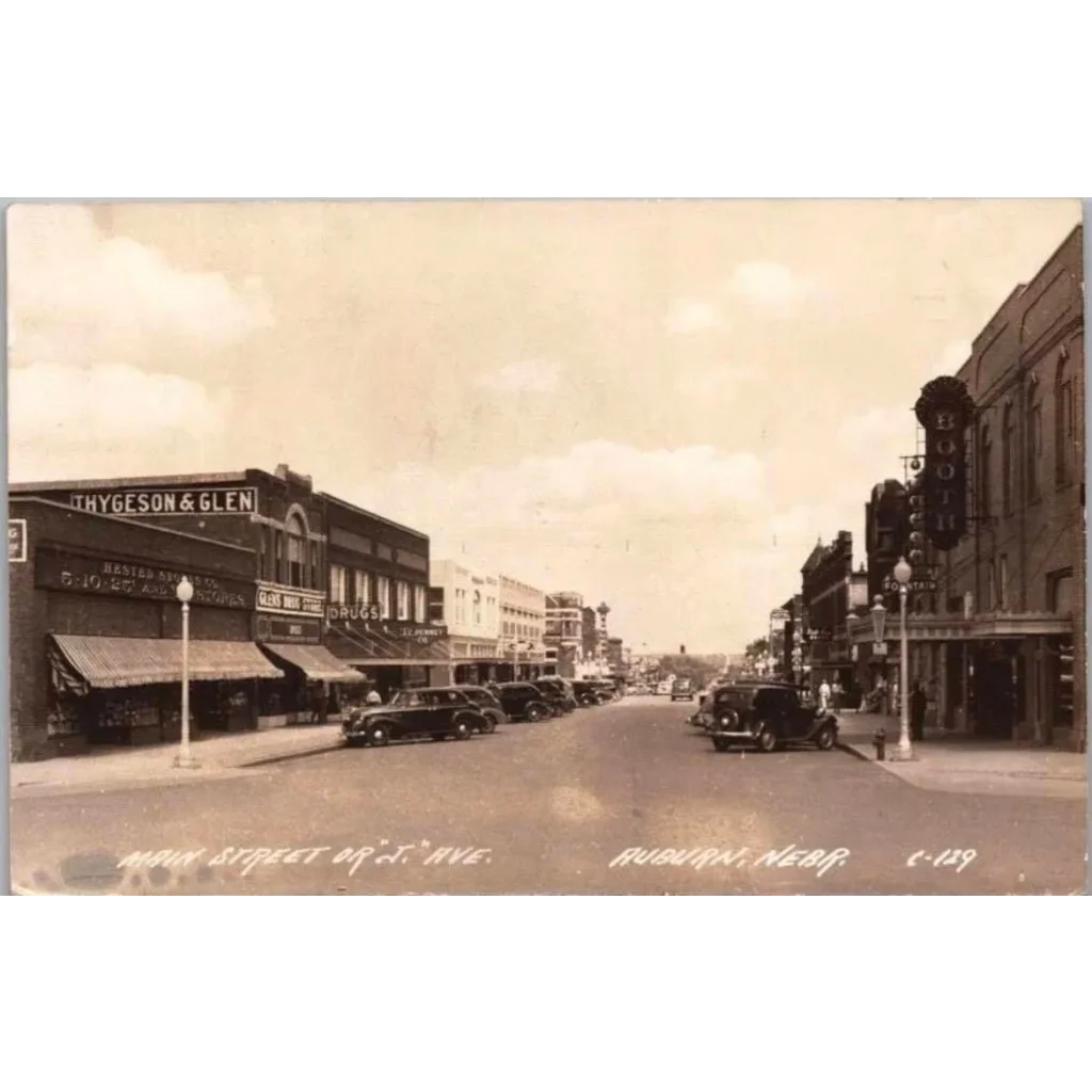 Vintage sepia postcard of Auburn Nebraska street with antique arsenate lead pharmacy label