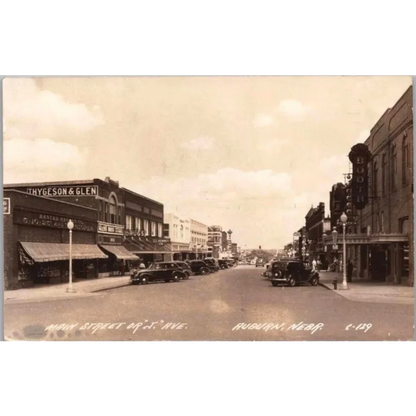 Vintage sepia postcard of Auburn Nebraska street with antique arsenate lead pharmacy label