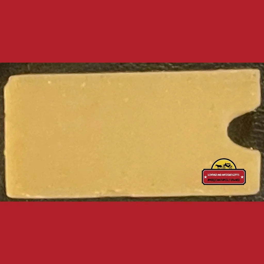 Block of cheese with red label in 1910s Glattolin Wax Collar Remedy Box