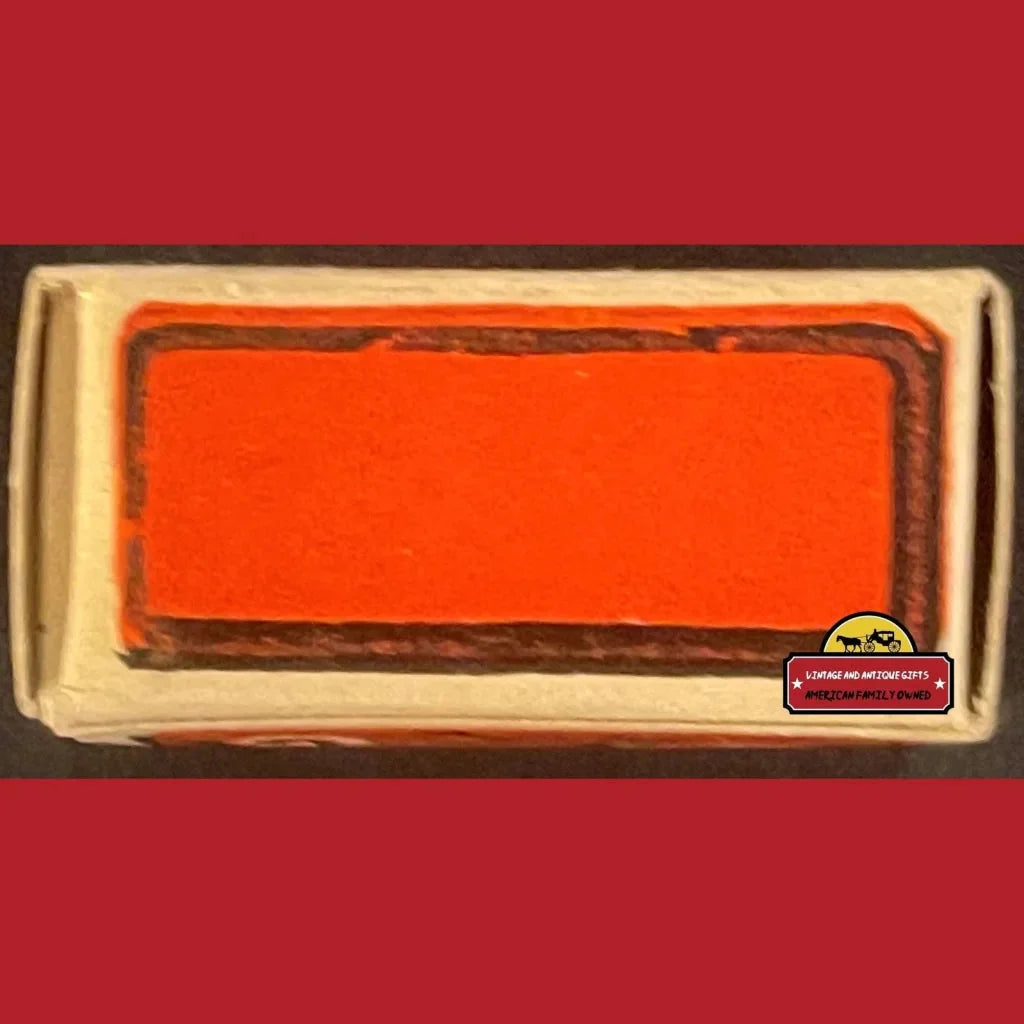 Vintage-style license plate frame with blank orange insert perfect for Glattolin Wax display