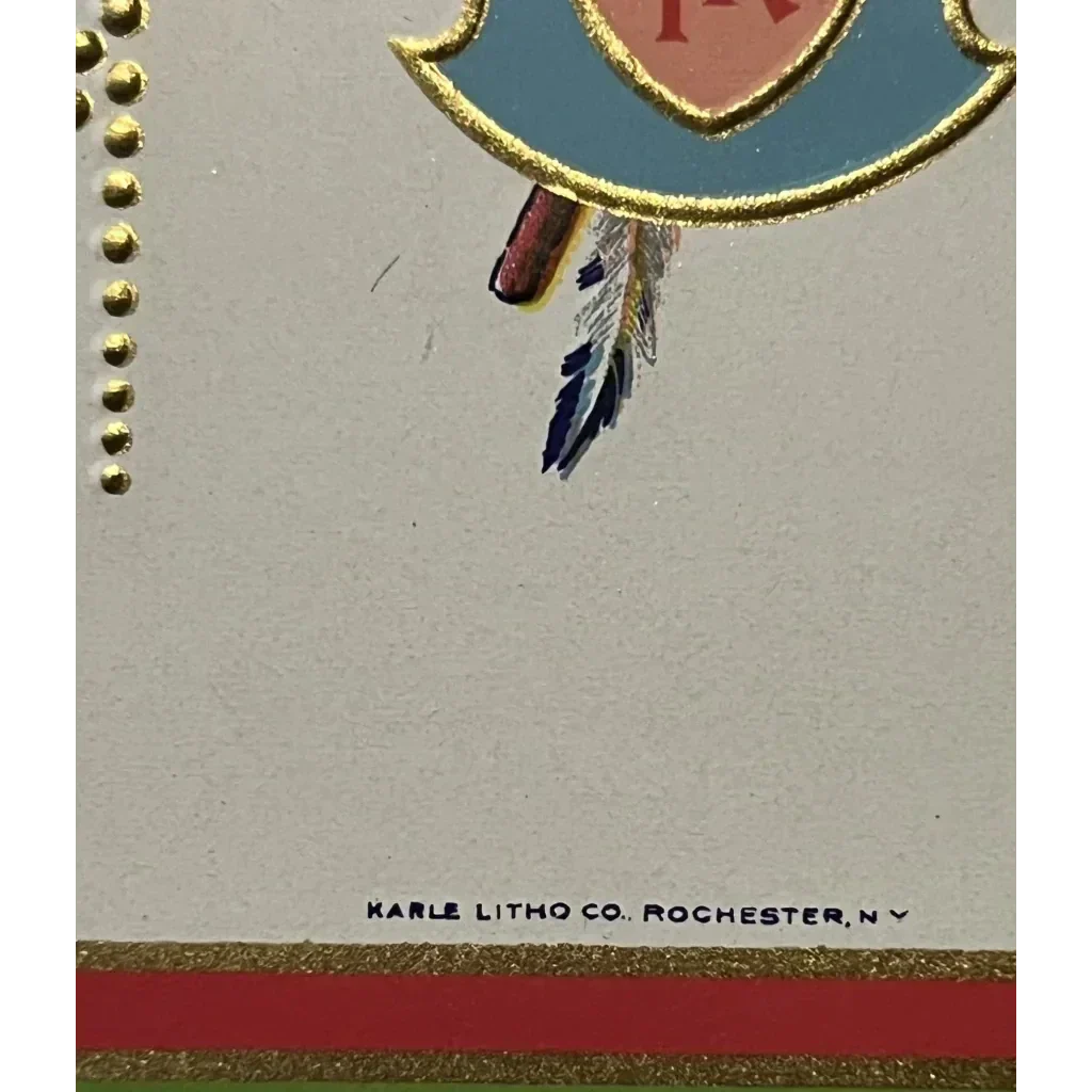 Partial view of a decorative Native American crest with a heart and feathers