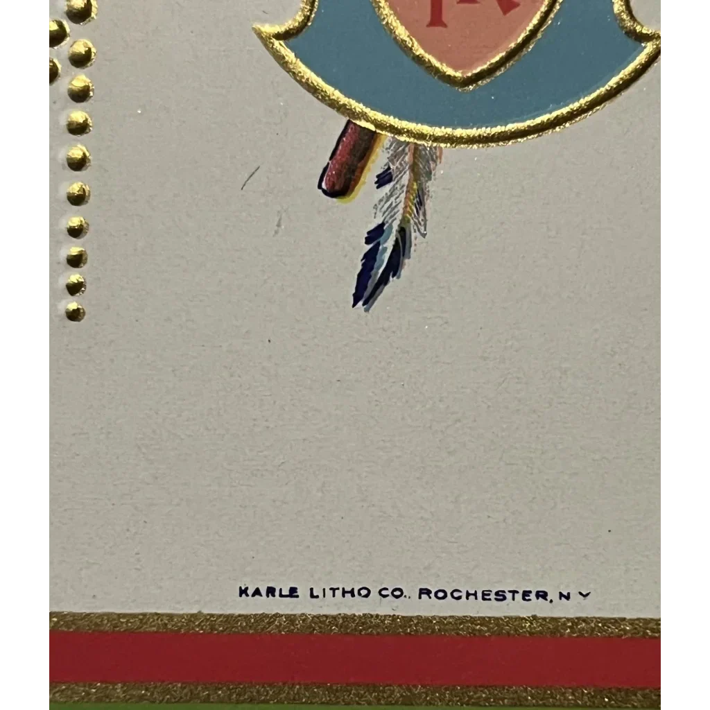 Partial view of a Native American crest with heart and feathers on antique gift