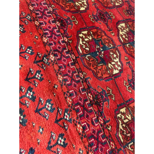 Antique 1920s Tribal Turkoman Tekke Wedding Rug with vibrant red geometric floral patterns