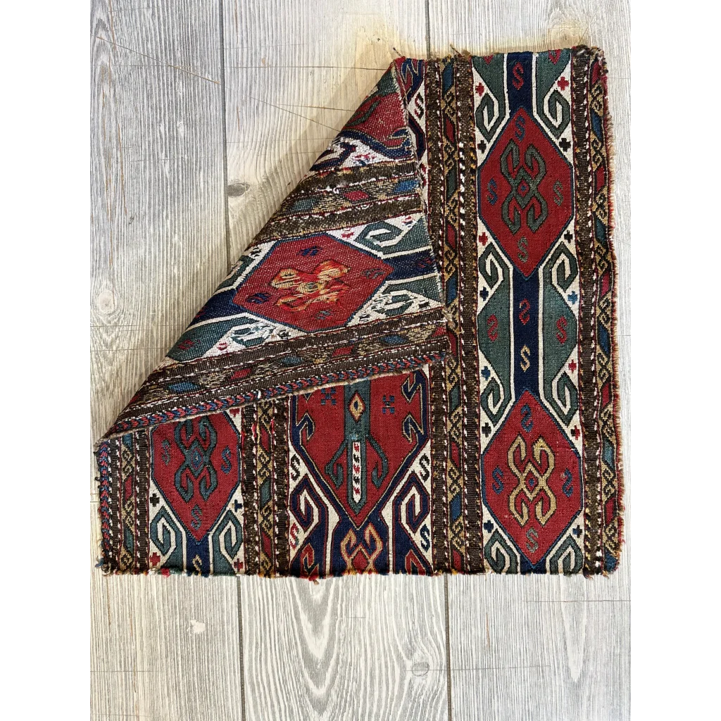 Vintage Caucasus natural wool pile rug with bold red, blue, green geometric patterns