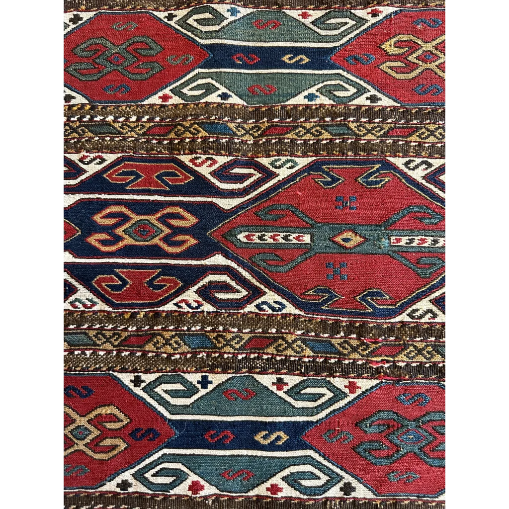 Vibrant Antique Caucasus natural wool pile rug with bold geometric patterns