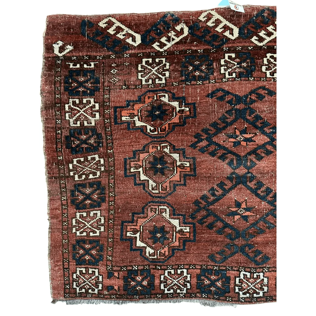 Antique Kizil Ayak Turkoman chuval rug with red field and geometric patterns, 60x34 inches