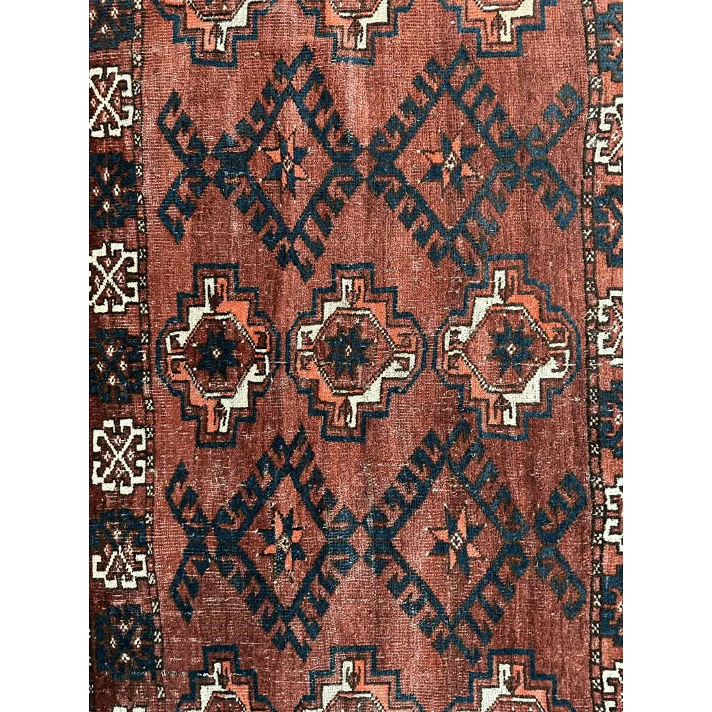 Antique Kizil Ayak chuval rug with rust-red field and tribal motifs