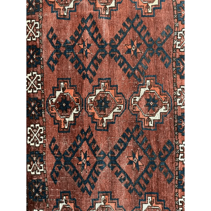 Antique Kizil Ayak chuval rug with rust-red field and tribal motifs