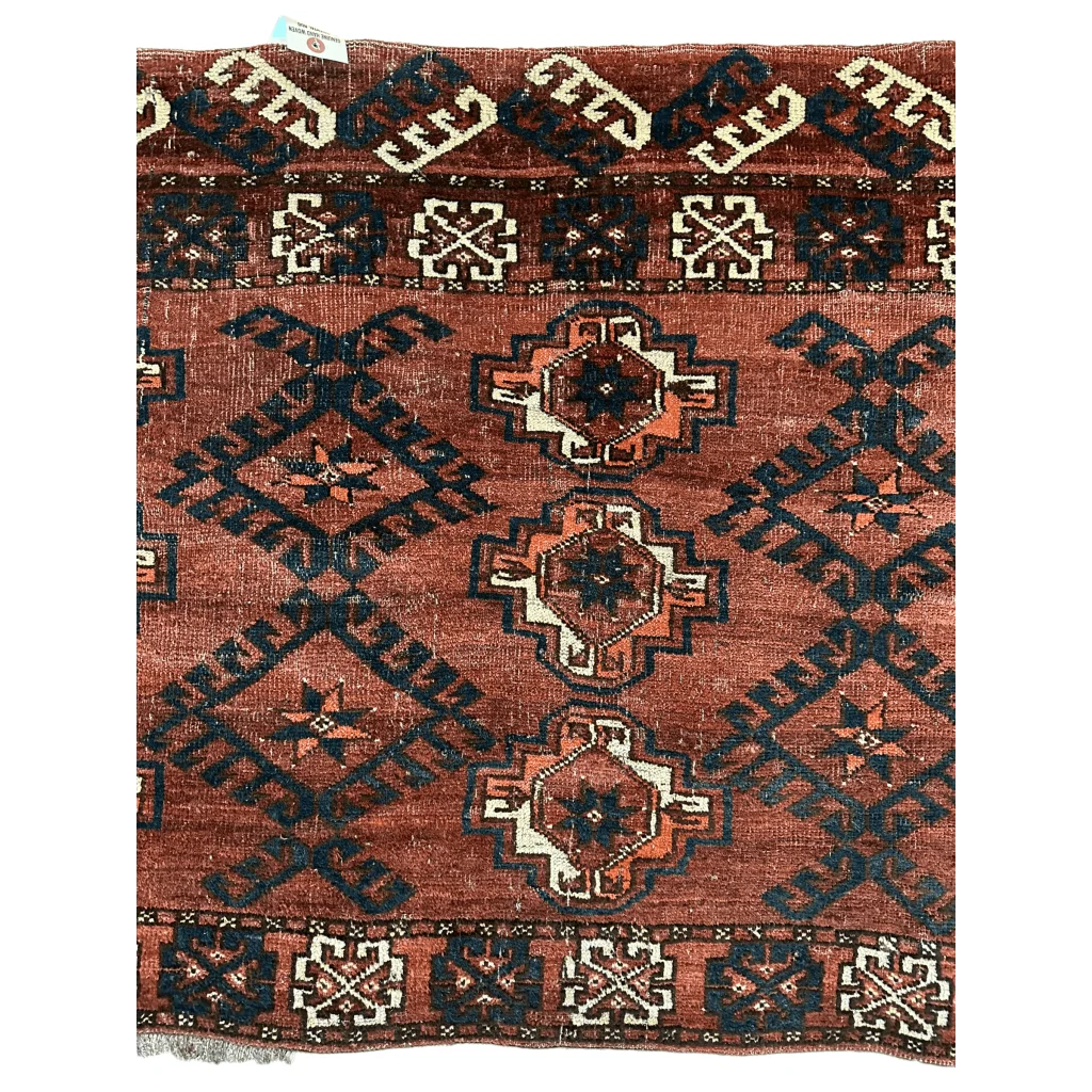 Antique Kizil Ayak chuval rug rust-red field navy geometric medallions