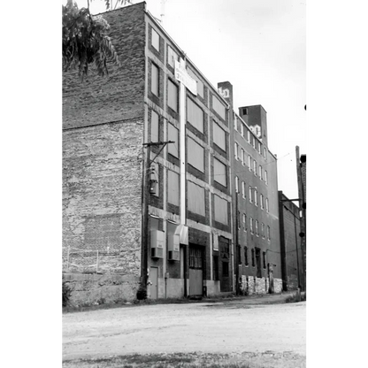 Vintage orphan boy smoking tobacco label on brick St. Louis building