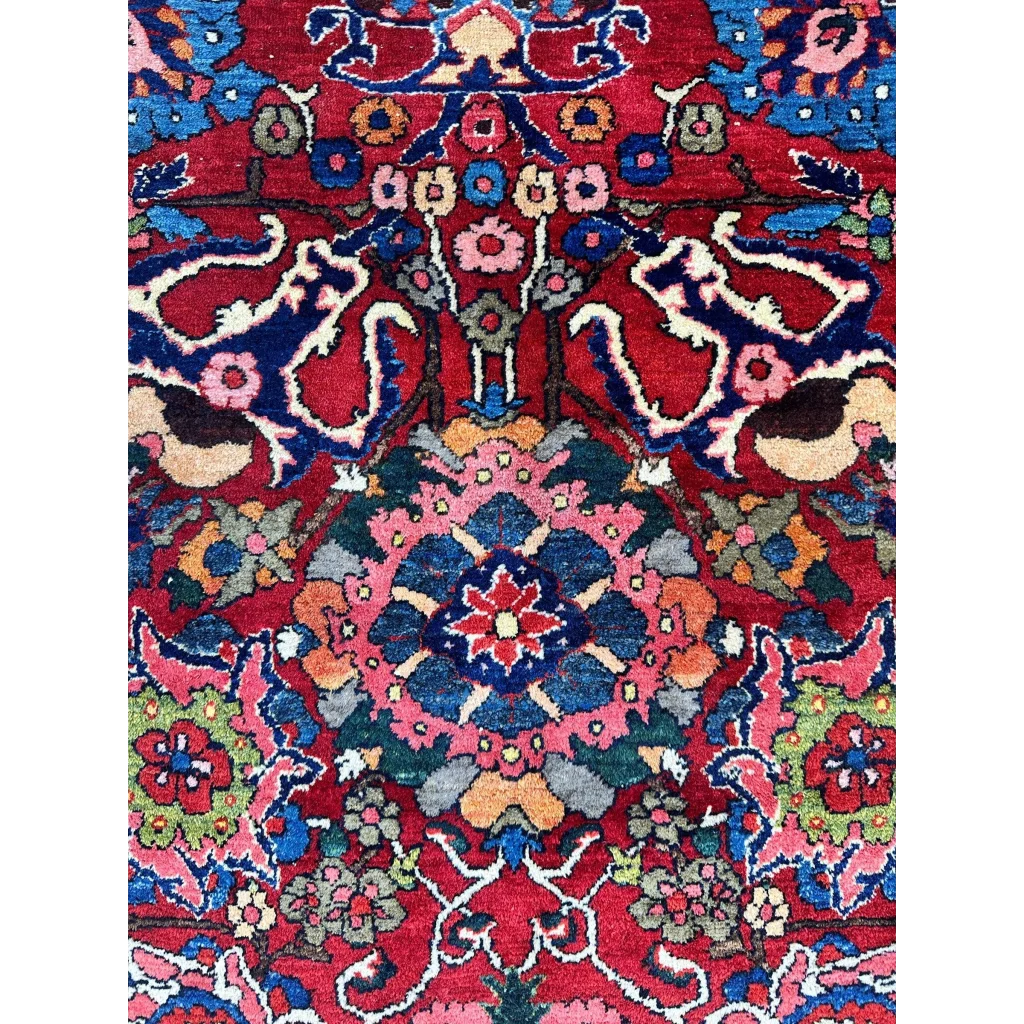 Vibrant red Persian Bakhtiari rug with floral details