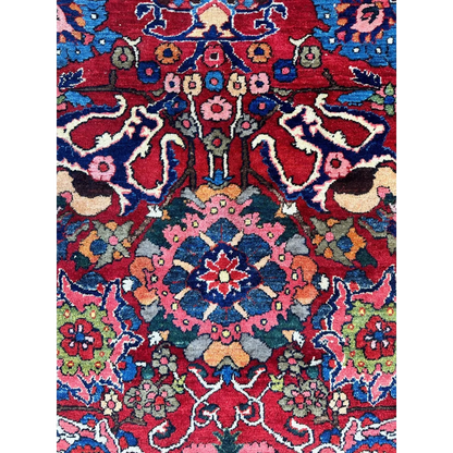 Vibrant red Persian Bakhtiari rug with floral details