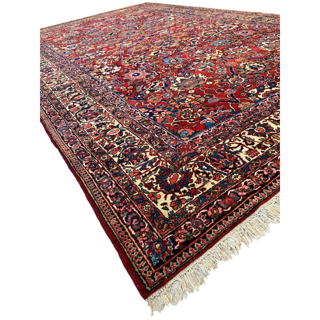 Rich Persian Bakhtiari rug with floral patterns in red, navy, gold