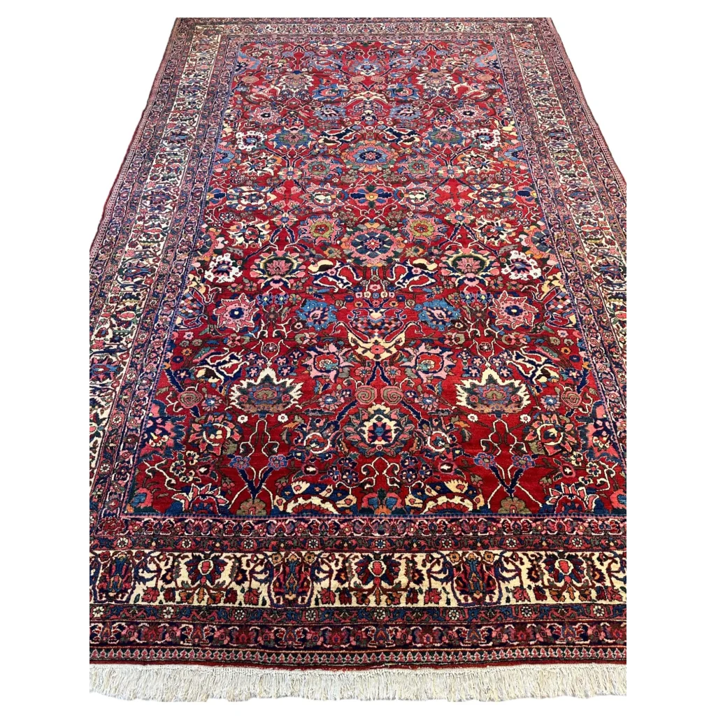 Antique Persian Bakhtiari rug with intricate floral vine details in red field