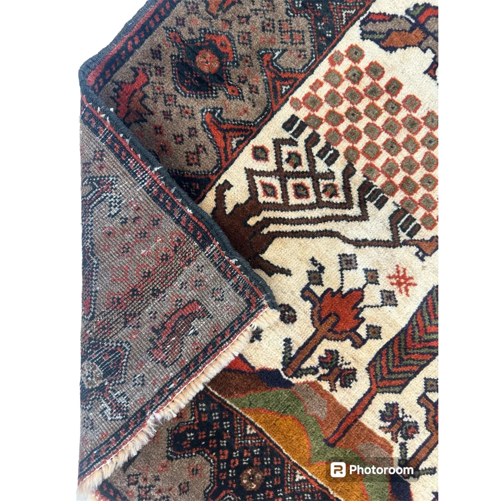 Vintage 1940s Persian Baluch wool rug with low pile geometric floral patterns