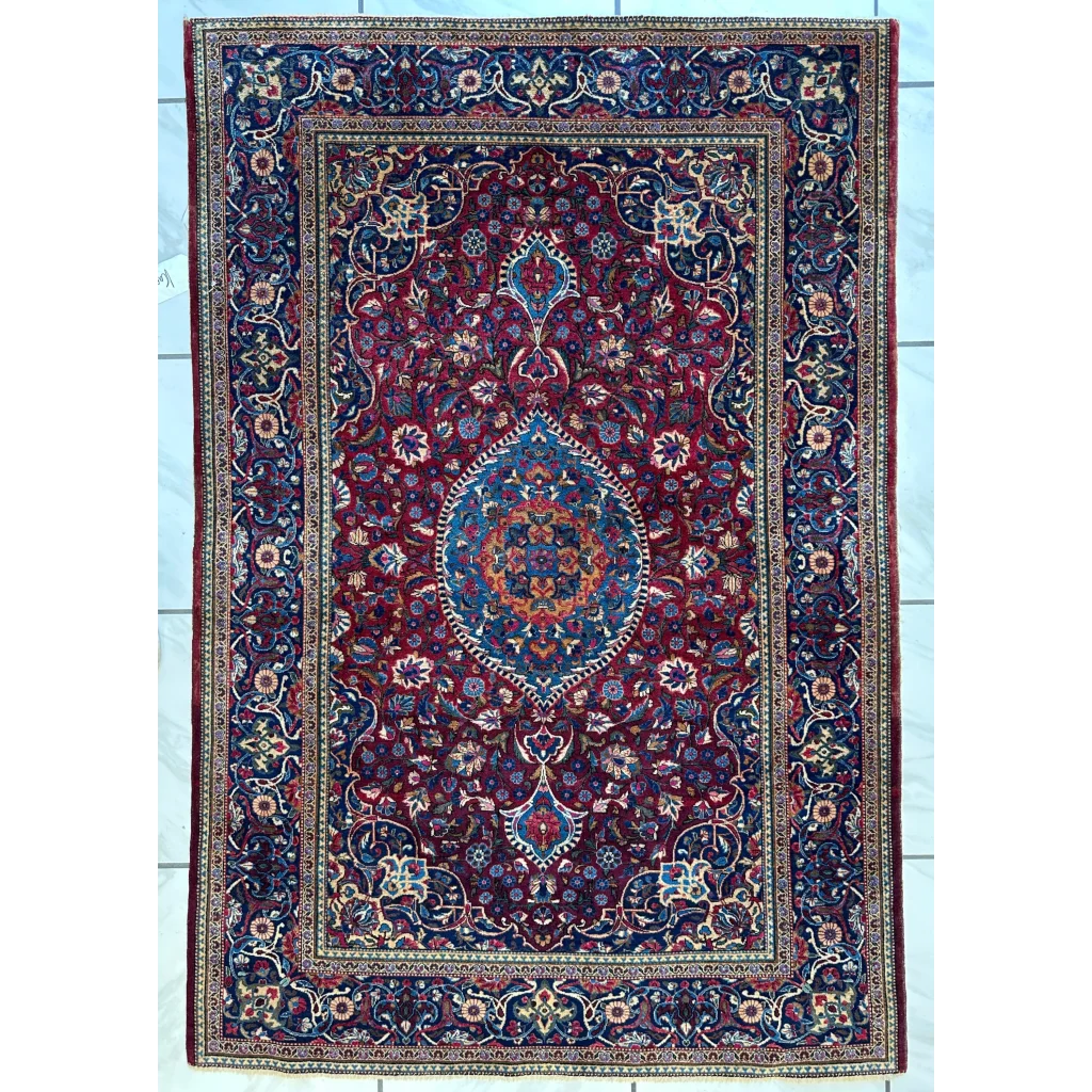 Antique Persian Kashan Debir rug with red field and intricate patterns