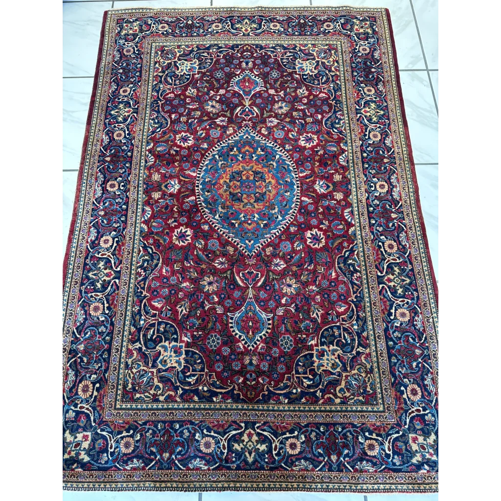 Antique Persian Kashan Debir rug with red navy floral patterns