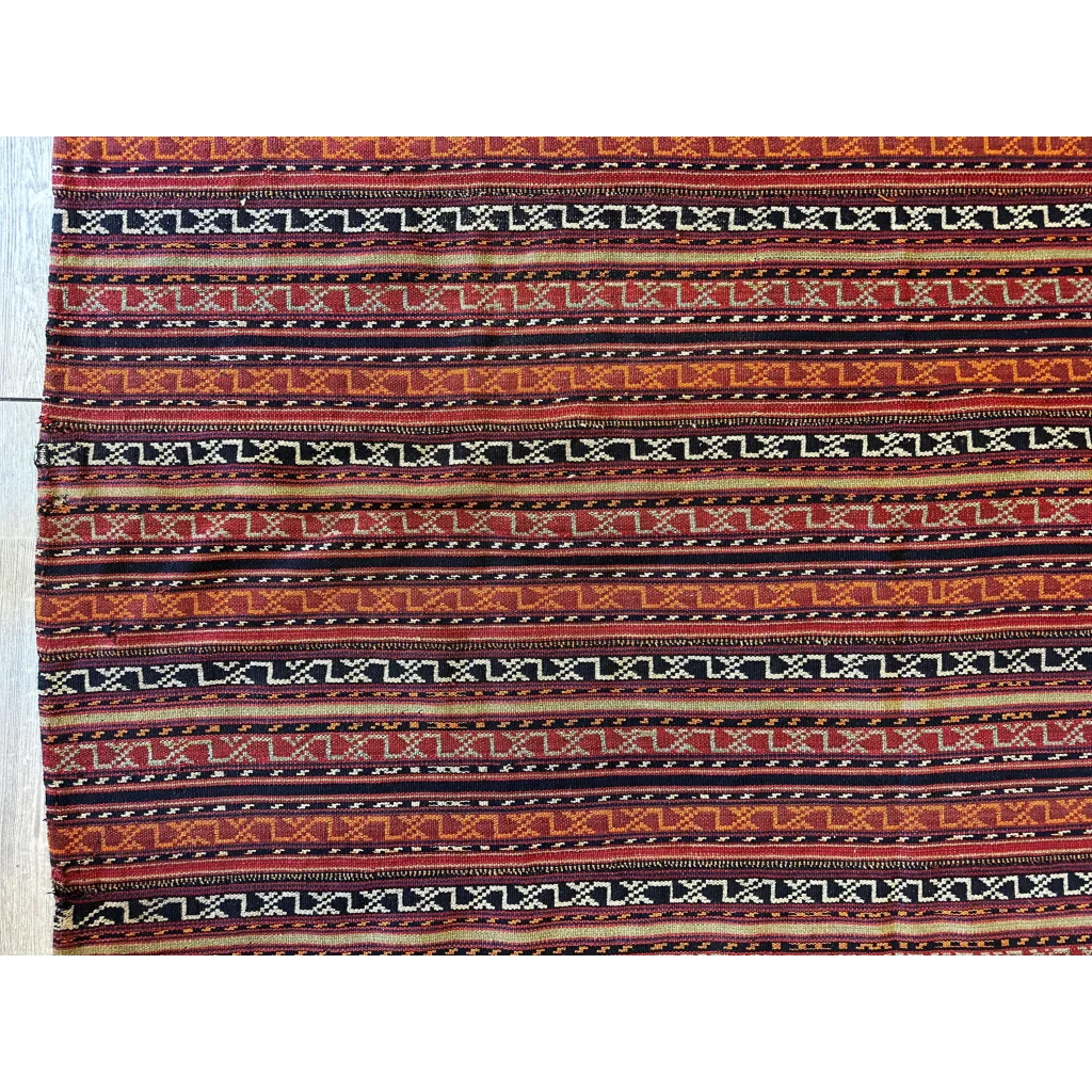 Antique Shahsavan Jajim flatweave rug, close-up of geometric patterns in reds browns and natural dyes