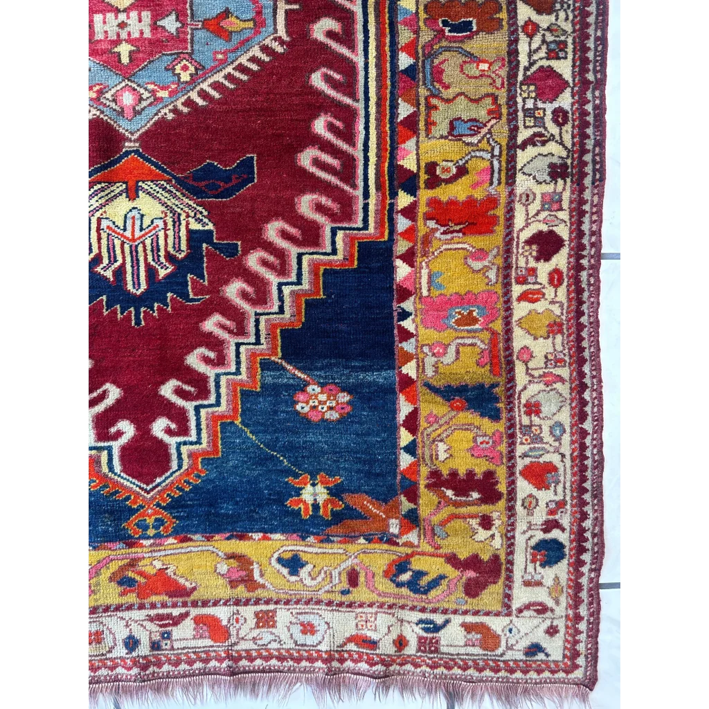 Vibrant antique Turkish Melas rug with geometric and floral patterns
