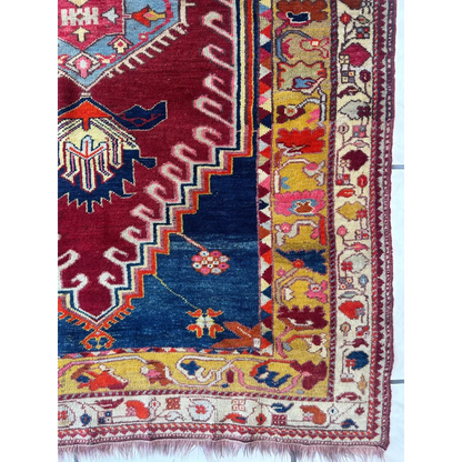 Vibrant antique Turkish Melas rug with geometric and floral patterns