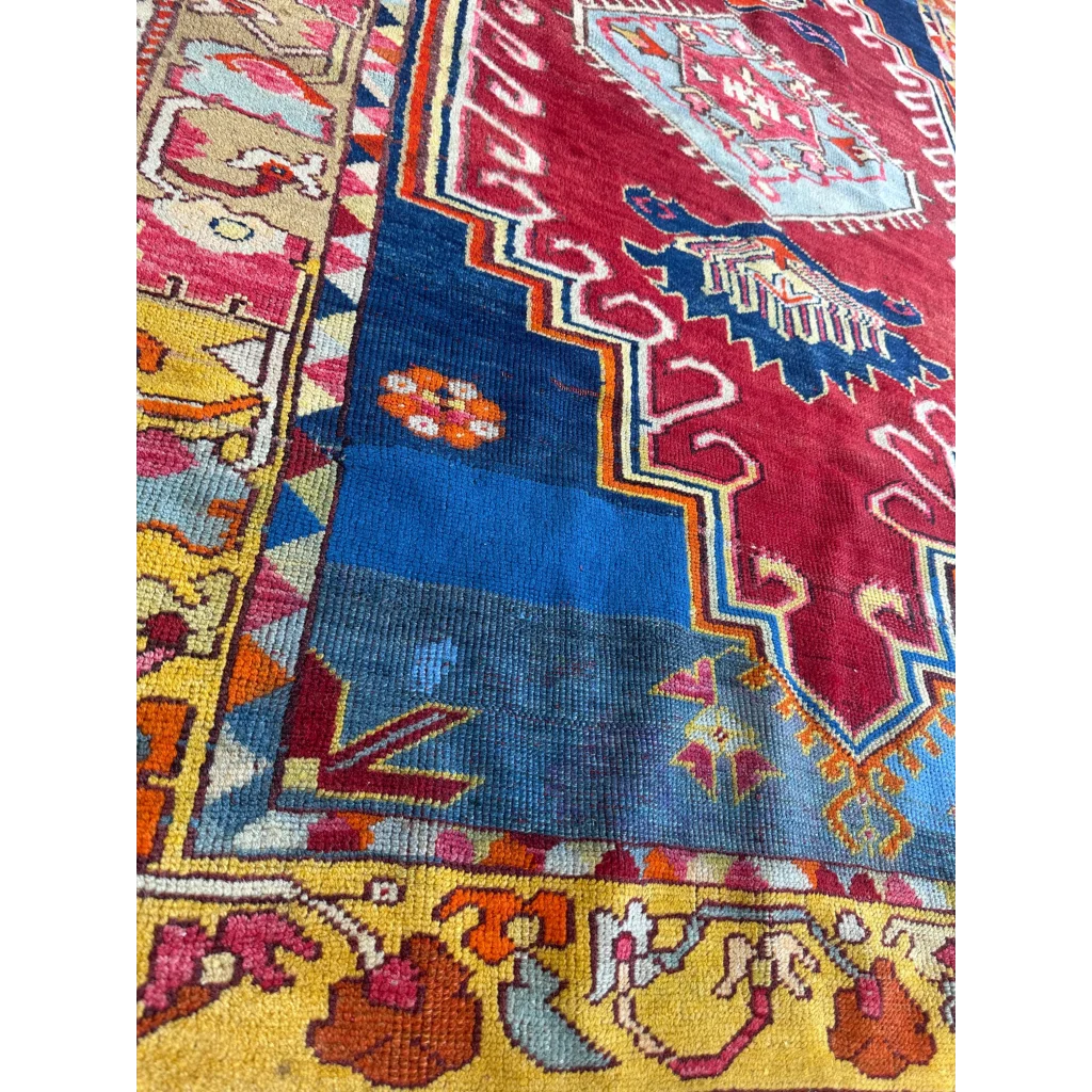 Vibrant antique Turkish Melas rug with intricate geometric patterns