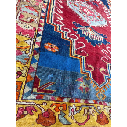 Vibrant antique Turkish Melas rug with intricate geometric patterns