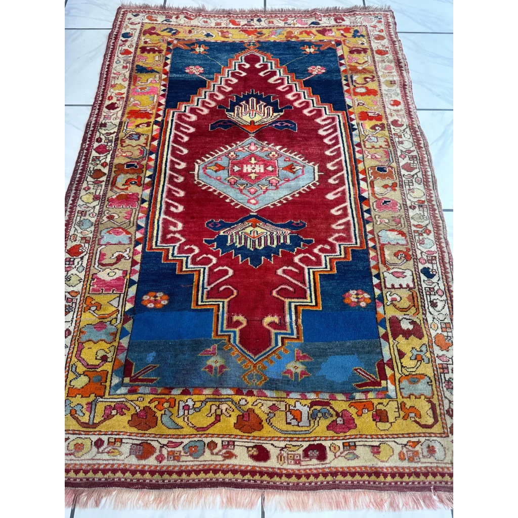 Vibrant antique Turkish Melas rug with geometric patterns and ornate borders