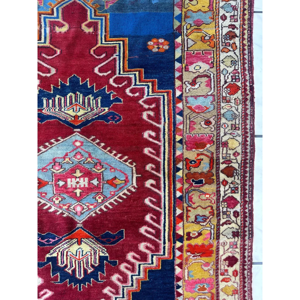 Vibrant antique Turkish Melas rug with red blue geometric motifs