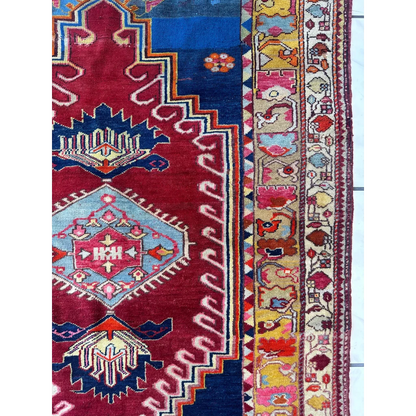 Vibrant antique Turkish Melas rug with red blue geometric motifs